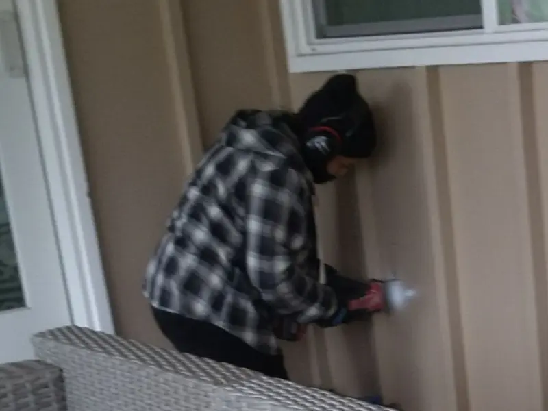Professional electrician installing an exterior outlet in Lake Geneva